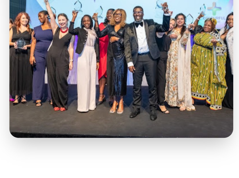 Award winners and event attendees gathered on stage at a National B.A.M.E Health and Care Awards event